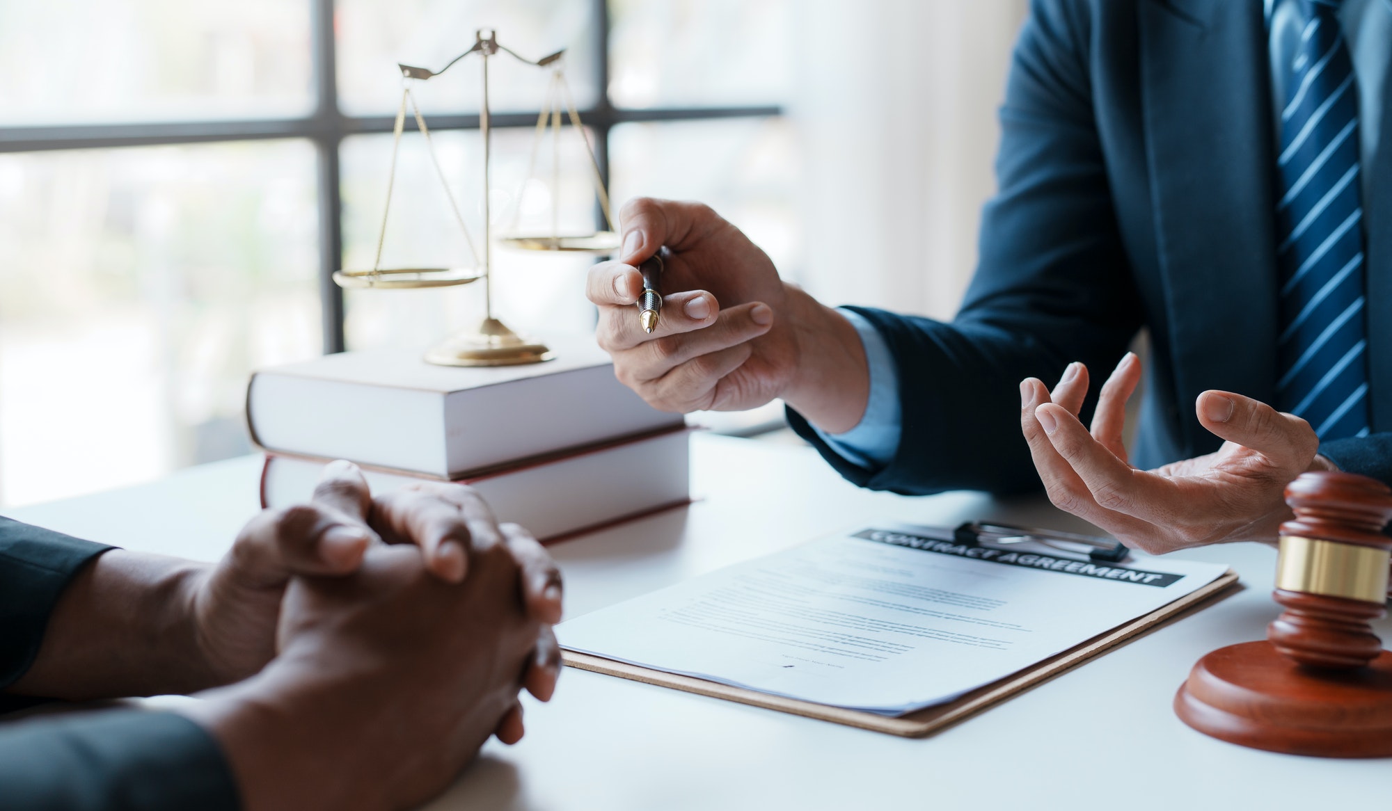 Lawyer and client sign variou financial legal contract to mediate with the legal execution