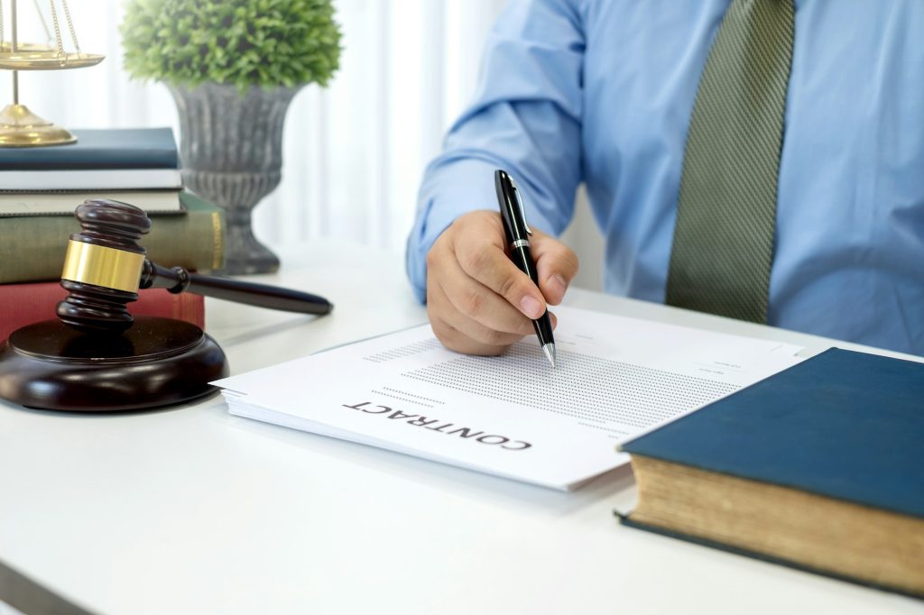 Lawyer and contract document in the office.